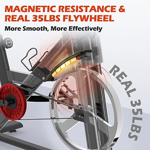 JOROTO Bicicleta Estática Magnética, bici estatica para en Casa con transmisión por correa, manillar ajustable en 4 direcciones, monitor LCD, soporte para tableta extra grande, capacidad de 150 kg.